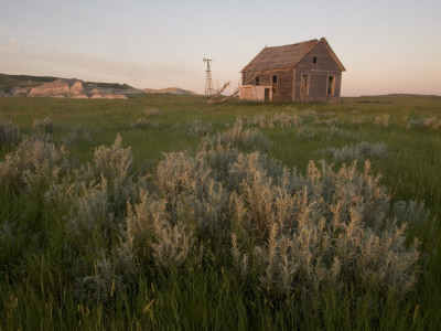 Buy An Abandoned House Sits Near White Butte in the Grasslands at AllPosters.com