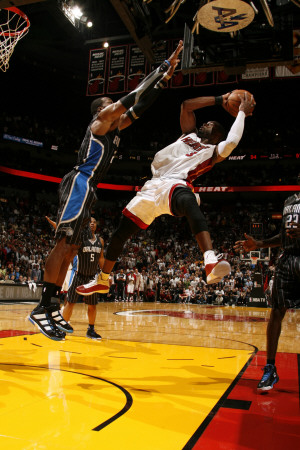 Orlando Magic v Miami Heat, Miami, FL - March 3: Dwyane Wade and Dwight Howard Poster
