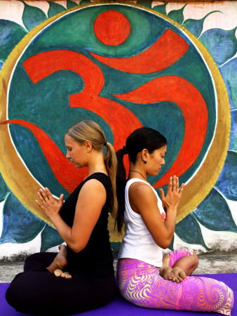 Yoga Practitioners Meditating in Lotus Pose