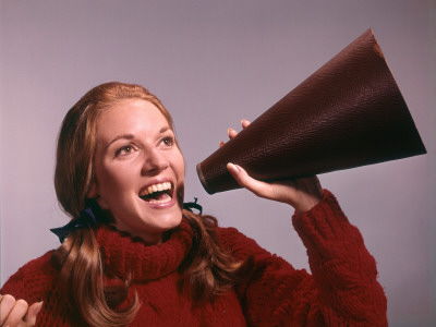 Portrait of Teen Cheerleader Shouting Into Megaphone Poster