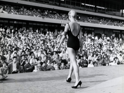 Female Competitor in Beauty Contest, Wearing One-Piece Bathing Suit and Heels