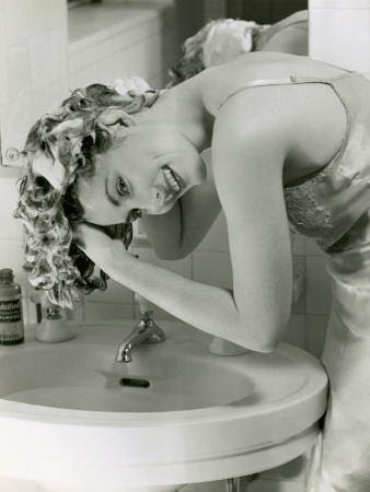 Woman Washing Her Hair in Sink