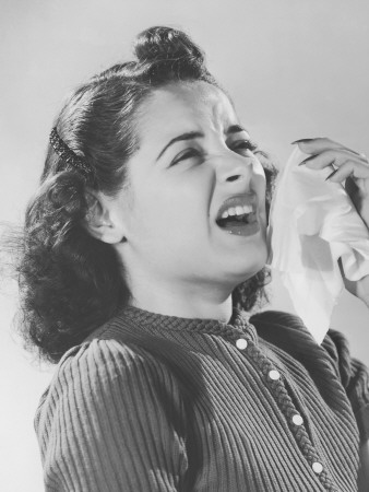Woman Sneezing Into Handkerchief