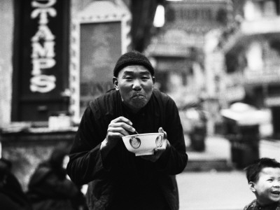 Chinese Man Using Chopsticks To Eat From Bowl, Portrait, Hong Kong
