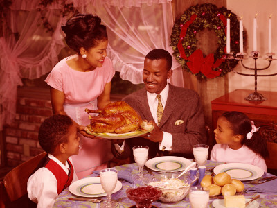 Family Preparing To Eat Christmas Dinner