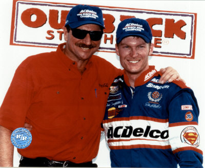 Dale Sr And Dale Jr  With Outback Steakhouse Sign In Background