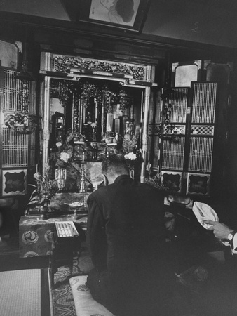 Japanese Politician Hayato Ikeda Praying at a Family Alter During His Campaign for Premier