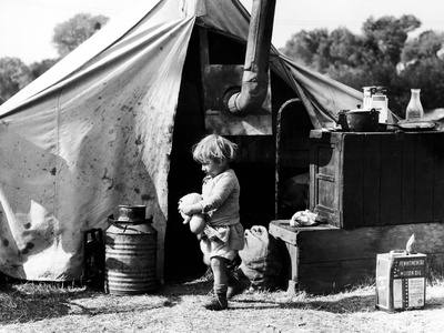 Little Girl, Daughter of "Fruit Tramps" Outside Tent She Shares with Her Parents and Four Siblings