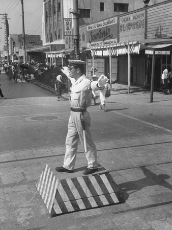 Japanese Police Officer Directing Traffic