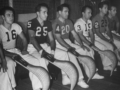Jai Alai Players Waiting on Bench Courtside, Waiting to Play their Matches