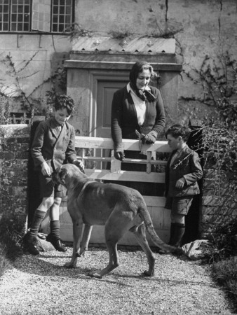 Lady Reading Standing with Two Small Neighbors and Her Dog Tiger at Her Country Bungalow