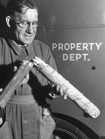 Propman Kuehl Holding Breakaway Club Made of Balsa Wood, Previously Broken and Now Held Together Poster