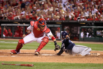 Brewers v St. Louis Cardinals - G. Four - Oct. 13: Jerry Hairston Jr. and Yadier Molina