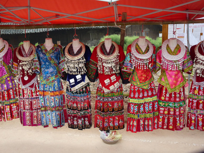 Buy Silver Adorns Traditional Miao Tribe Dresses Hanging on Mannequins at AllPosters.com