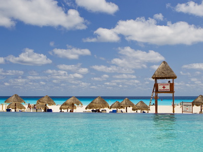The Caribbean Sea, Tiki Huts and a Lifeguard Stand from a Resort Pool