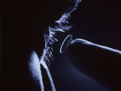 Buy Close Up of Man Inserting a Contact Lens into His Eye at AllPosters.com