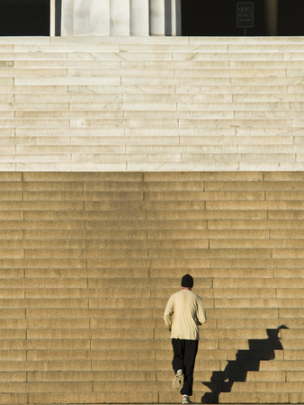 Buy An Early Morning Jogger Casts His Shadow on the Lincoln Memorial Steps at AllPosters.com
