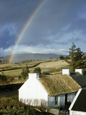 Buy A Rainbow Arches over a Thatched White Cottage and Nearby Fields at AllPosters.com