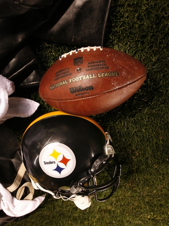 Bills Steelers Football: Pittsburgh, PA - A Pittsburgh Steelers Helmet and Football