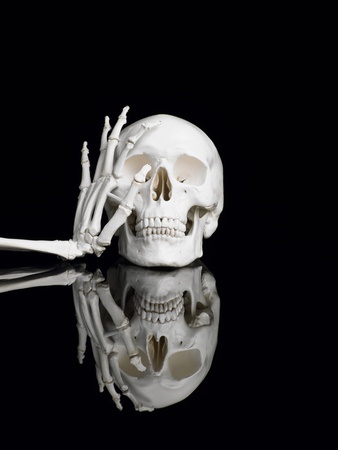 Human skull and skeleton hand