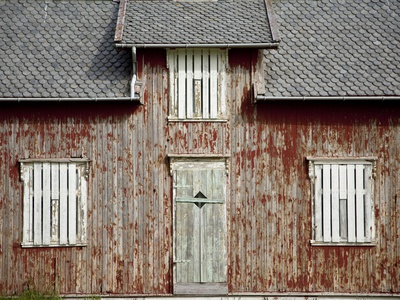 A Weathered, Once Red, Home on the Island of Vaeroya