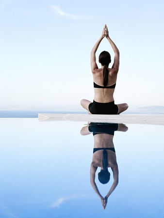 Woman Exercising on Swimming Pool Edge