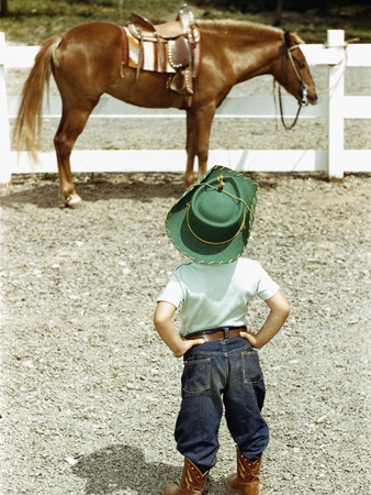 Buy Young Cowboy Looking at Horse at AllPosters.com