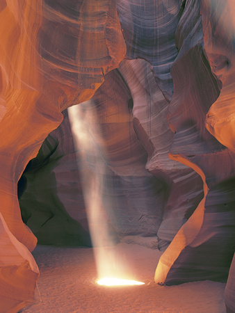 Sunbeam Illuminates Sandy Floor and Sandstone Walls of a Slot Canyon, Antelope Canyon, Page