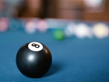 Eight ball on pool table
