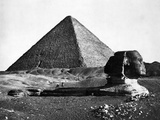The Sphinx and the Pyramid of Cheops Standing in the Desert