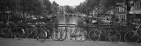 Bicycle Leaning Against a Metal Railing on a Bridge, Amsterdam, Netherlands