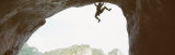 Silhouette of a Man Climbing a Rock, Railay Beach, Krabi, Thailand