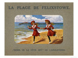 Two Girls in Look-Alike Costume Run Hand in Hand Along the Sand at Felixstowe Suffolk