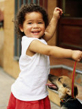 Buy Young Girl with Puppy at Sunday Market, Mataderos, Buenos Aires, Argentina at AllPosters.com