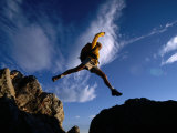 Hiker Jumping Between Rocks in the Wasatch Mountains, Wasatch-Cache National Forest, Utah, USA