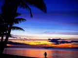 Couple Walking Along Beach at Sunset, Fiji