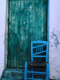 Chair in Front of a Green Door in the Village of Caceres, Caceres, Extremadura, Spain