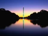 An Illuminated Washington Monument Reflects in the