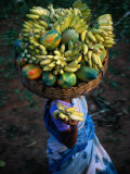 Local Woman Balancing Paw Paw and Bananas on Head at Market, Bangalore, Karnataka, India
