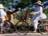 Buy Girl Riding Bike, Ho Chi Minh, Vietnam at AllPosters.com