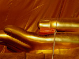 A Saffron Monks Robe Placed in the Hands of Buddha at Wat Mongkhon Bophit, Ayuthaya, Thailand