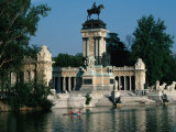 People Canoeing Past Parque Del Retiro, Madrid, Spain