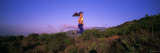 Young Woman Running on a Hill