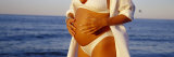 Pregnant Woman Touching Her Abdomen, Oak Street Beach, Chicago, Illinois, USA