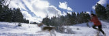 Side Profile of a Woman Chasing a Dog in Snow, Sangre de Cristo Mountains, New Mexico, USA