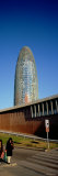 Two Women Walking near a Building, the Torre Agbar, Barcelona, Spain