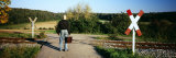 Buy Man Standing near a Railroad Crossing, Germany at AllPosters.com