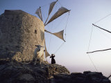 Buy Woman Adjusting Sails of a Windmill, Olimbos, Karpathos, Greece at AllPosters.com