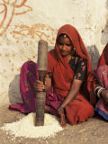 Woman Pounding Food in Village Near Deogarh, Rajasthan State, India