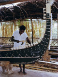 Buy Craftsman Building Traditional War Canoe with Pearl Shell Inlay and Carved Nguzuaguzu Head at Base at AllPosters.com